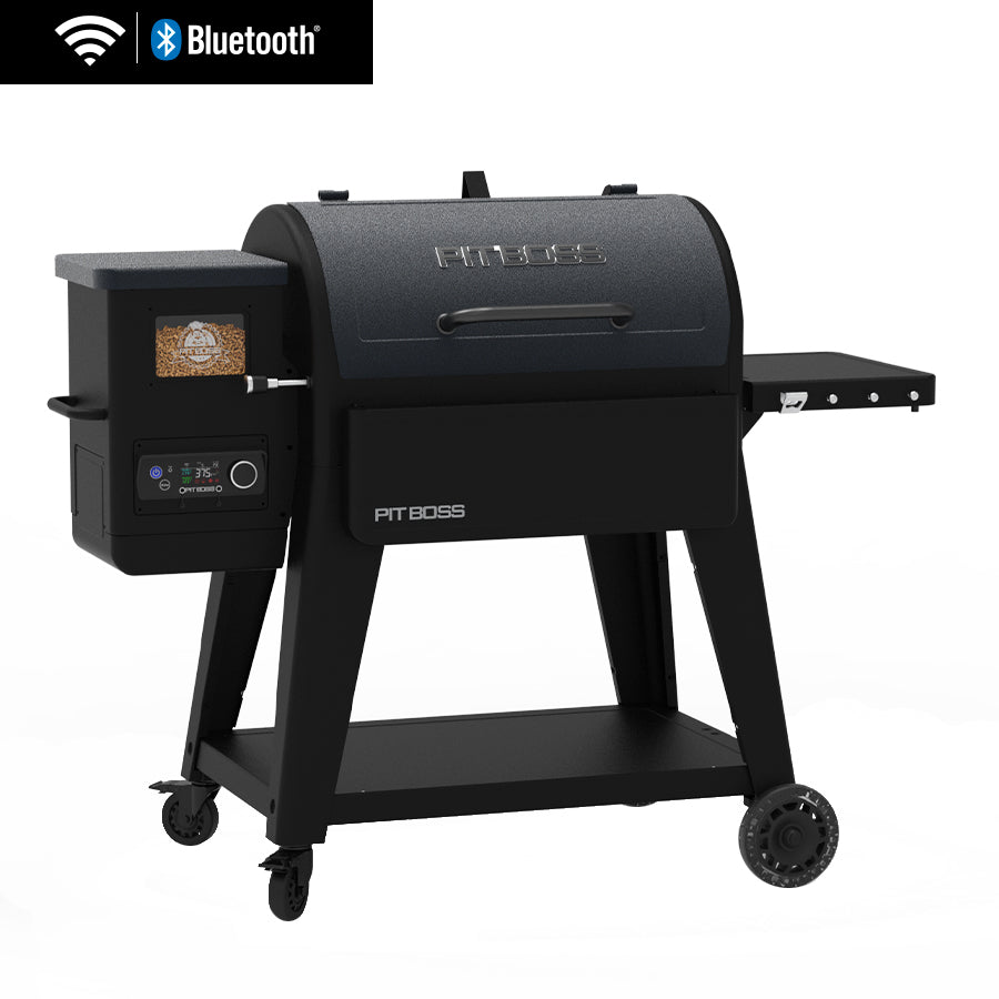 Pit Boss Navigator 850 style pellet grill with a folding side shelf and tool hooks on a patio deck